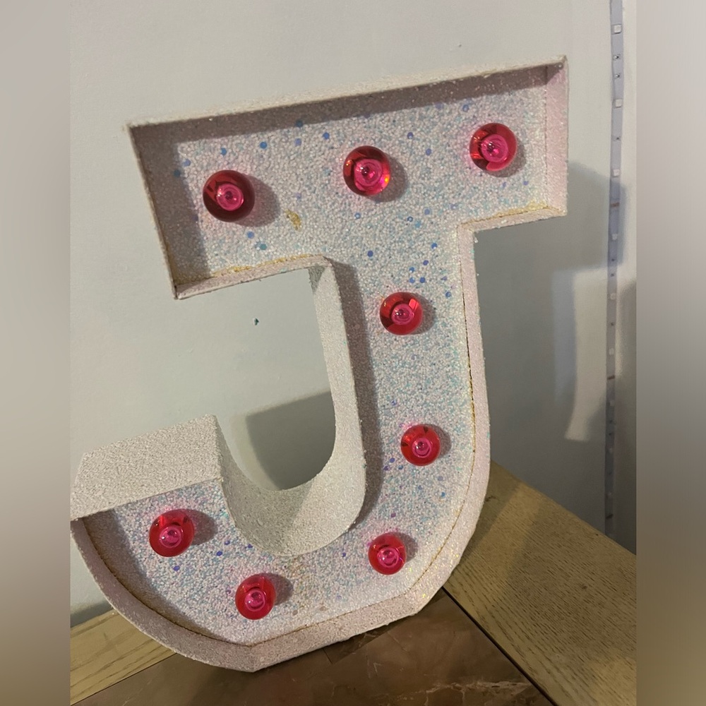 J Initial Light up from Justice